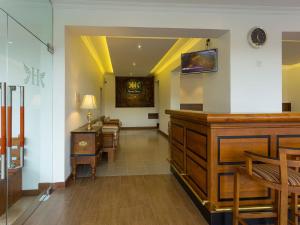 a hallway with a waiting room with a table and chairs at Heaven Seven Kandy in Kandy +65 photos