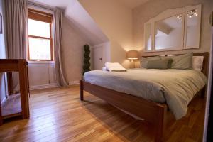 a bedroom with a large bed and a window at Le Metro Mont-Royal by HomeInMontreal in Montreal