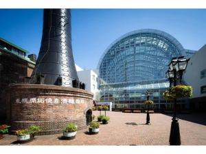 a large building with a black object in front of it at Park Hills OM Chuo 12 - Vacation STAY 19390 in Sapporo