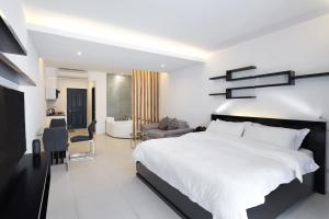 Postel nebo postele na pokoji v ubytování Winds Boutique Hotel