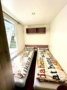 a room with two beds in it with a window at Cottage 1 in Agarn +8 photos