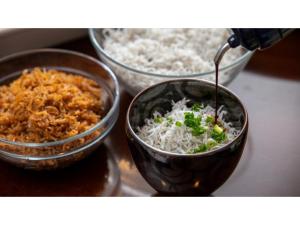 three bowls of food on a counter with rice at Yunoko Umi To Yuyake - Vacation STAY 83043v in Minamata