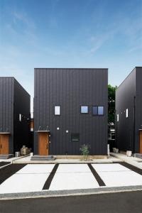 a large black building with two entrances to it at Fuji Petel - Vacation STAY 56350v in Azagawa
