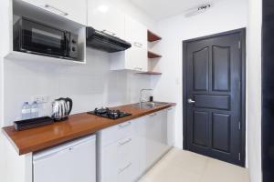 Kuchyň nebo kuchyňský kout v ubytování Winds Boutique Hotel