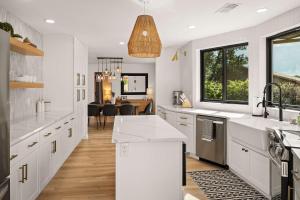 a kitchen with white countertops and a dining room at Prime location with Hot tub Pool and Views for Family in Sedona