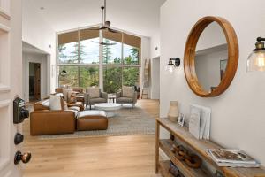 a living room with a couch and a mirror at Prime location with Hot tub Pool and Views for Family in Sedona