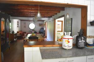 a kitchen and dining room with a counter top at Hostal Pando in Santa Cruz