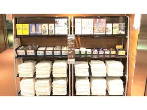 a store shelf filled with lots of white towels at Smile Hotel Kawaguchi - Vacation STAY 76839v in Kawaguchi