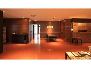 a room with a desk and a table in a building at Smile Hotel Kawaguchi - Vacation STAY 76824v in Kawaguchi