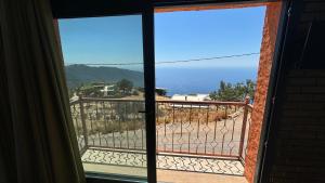 a view from a door of a balcony at Elm pansiyon in Fethiye