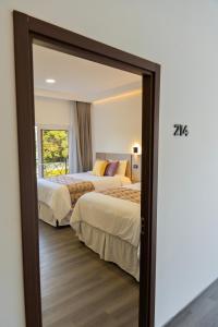 Cama o camas de una habitación en Elithe Hotel
