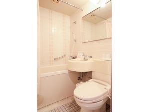 a bathroom with a toilet and a sink at Smile Hotel Sendai Kokubuncho - Vacation STAY 77755v in Sendai +23 photos
