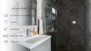a bathroom with a sink and a shower with a mirror at 1PH Hidden gem in Centro Fits 10 private terrace in Mexico City