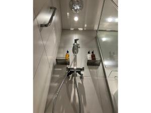 a shower in a bathroom with a glass wall at Smile Hotel Hiroshima - Vacation STAY 77672v in Hiroshima +19 photos