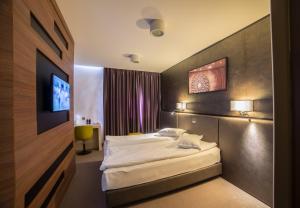 Кровать или кровати в номере Hotel Lux Divina