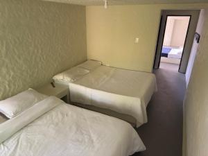 Postel nebo postele na pokoji v ubytování Jaragual EcoHostel