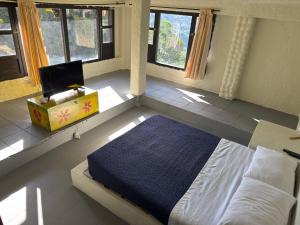 Postel nebo postele na pokoji v ubytování Jaragual EcoHostel