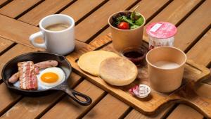a breakfast of eggs sausage bread and toast and coffee at Glamorous Dining Tateshina - Vacation STAY 81024v in Yukawa