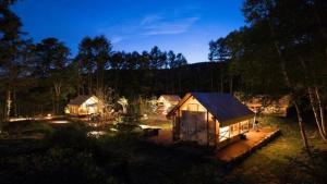 a cabin in the middle of a forest at night at Glamorous Dining Tateshina - Vacation STAY 81024v in Yukawa