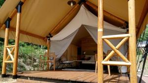a large tent with a wooden deck in the woods at Glamorous Dining Tateshina - Vacation STAY 81024v in Yukawa +2 photos