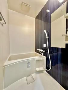 a bathroom with a shower with a toilet and a sink at YADORI - Vacation STAY 81027v in Osaka