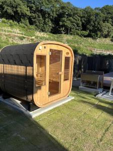 a small wooden boat sitting on a trailer in a yard at Awaji Island Ayayagumi Waterfall Terrace - Vacation STAY 81026v in Ōno