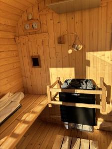 an inside of a wooden room with a stove at Awaji Island Ayayagumi Waterfall Terrace - Vacation STAY 81026v in Ōno