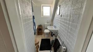 a small bathroom with a sink and a toilet at Ferienwohnung Harzgebirge in Goslar