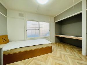 Postel nebo postele na pokoji v ubytování Sakura Kan - Vacation STAY 19675
