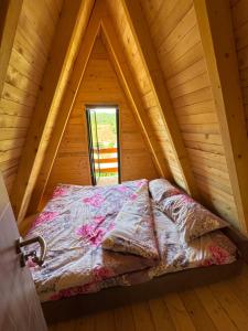 a bed in a room in a cabin at Villa Roi 3 in Ferizaj +7 photos