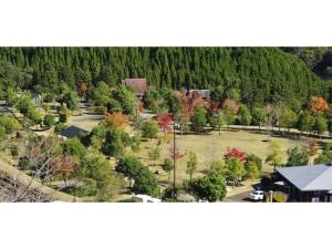 an aerial view of a park with trees and a house at Ume Camp Mura - Vacation STAY 88863v in Saiki