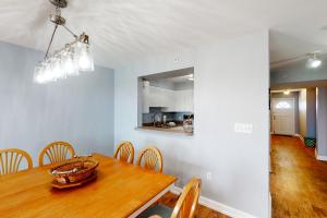 a dining room with a wooden table and chairs at Turn of River 4F in Folly Beach