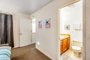 a bathroom with a sink and a toilet and a mirror at Whale-come Home in Depoe Bay +26 photos