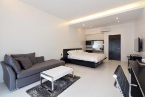 Postel nebo postele na pokoji v ubytování Winds Boutique Hotel