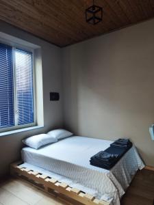 Ένα ή περισσότερα κρεβάτια σε δωμάτιο στο La Casetta Guest House 1