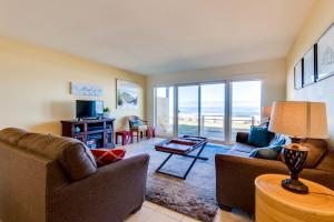 a living room with a view of the ocean at Pacific Sands Unit #10 in Neskowin