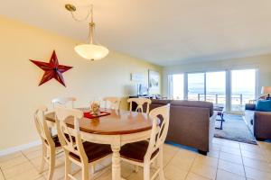 a dining room and living room with a table and chairs at Pacific Sands Unit #10 in Neskowin