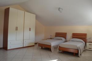Ένα ή περισσότερα κρεβάτια σε δωμάτιο στο Residence con Piscina Vista Monte Nerone +12 φωτογραφίες