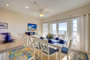 a kitchen and dining room with a table and chairs at Shores Fine Again 836 #211DS-H in Hatteras