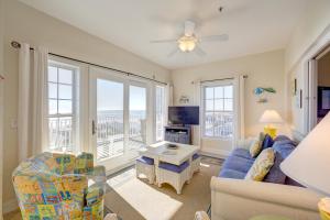a living room with a couch and chairs and a tv at Shores Fine Again 836 #211DS-H in Hatteras