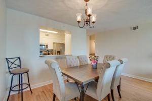 a dining room with a wooden table and chairs at Turn Of River 2F in Folly Beach +20 photos