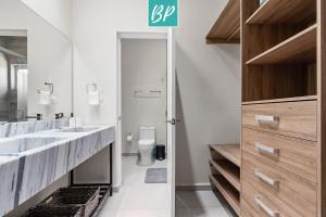 a bathroom with a sink and a toilet at Las Villas - Townhomes & Condos in Eastside Bucerias in Bucerías +39 photos