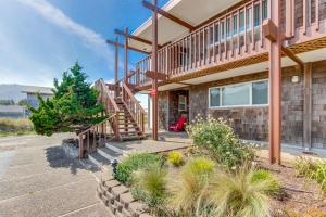 a house with a staircase in front of it at Pacific Sands Resort #19A in Neskowin +19 photos