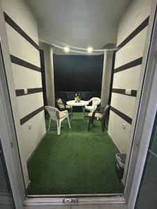 a view of a room with a table and chairs at Vila Mujadžić  +15 photos