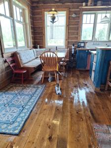 a living room with a table and a couch in a house at Breathtaking Cabin Away From Reality in Clark