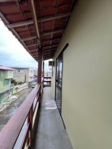 a balcony of a building with a view of a street at Apartamento aconchegante em ilheus in Ilhéus