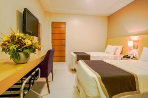 TV/trung tâm giải trí tại Hotel THE Aela International Airport By GROSS GROUP