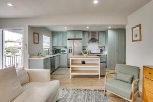 a living room with a couch and a kitchen at Hip Walkable Neighborhood Condo in San Diego in San Diego