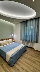 a bedroom with a bed and a large window at I Racconti del Fiume in Bussi sul Tirino
