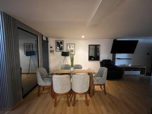 a living room with a dining room table and chairs at departamento en ica in Ica +7 photos